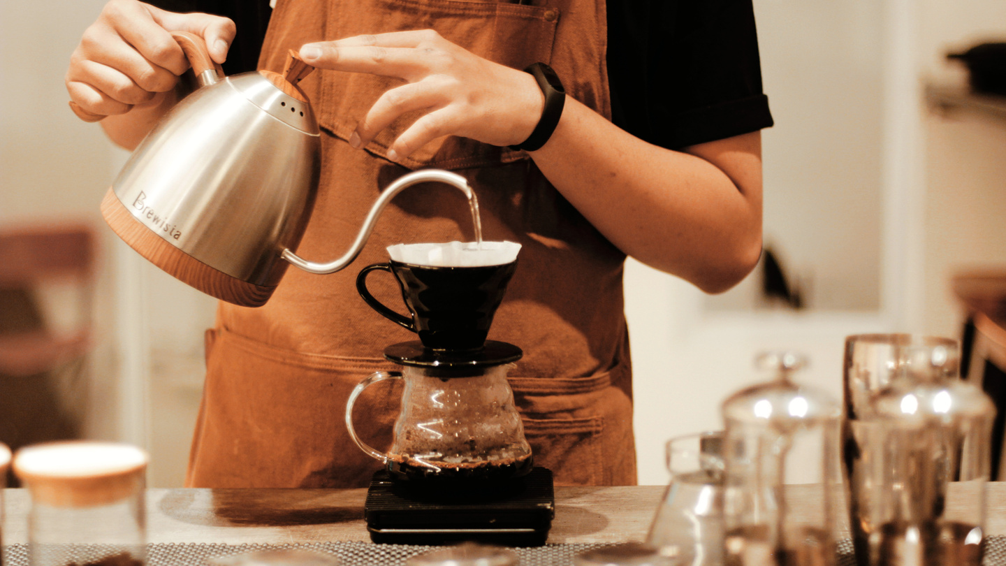 Barista Making Coffee with Manual Brew Process